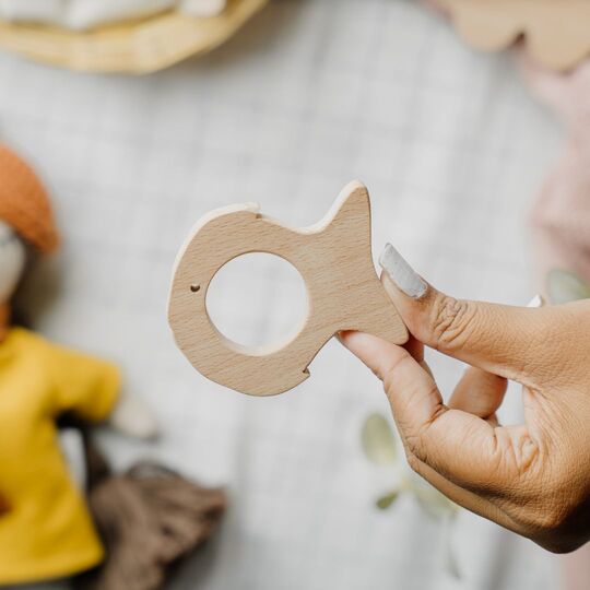 Wooden fish teether made from natural beech wood to soothe baby gums