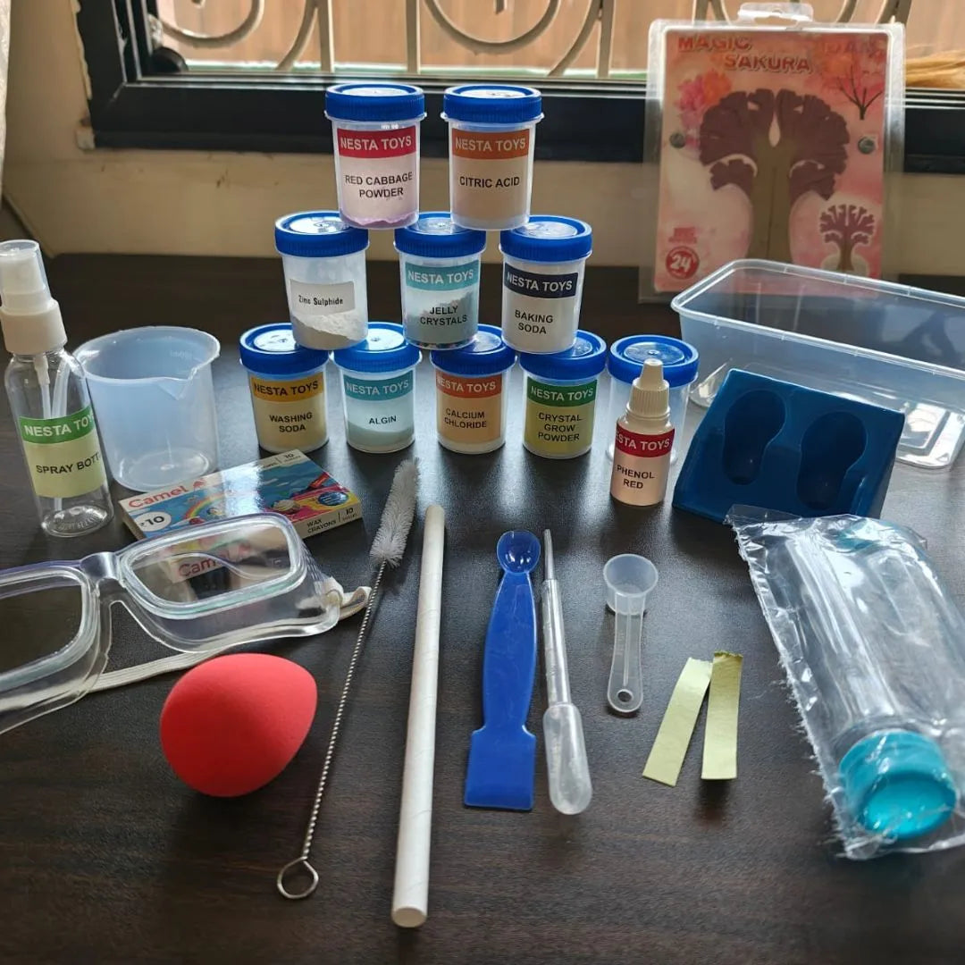 Kids chemistry lab kit with colorful experiment bottles, safety goggles, measuring tools, test tubes, and science accessories neatly arranged on a table for hands-on learning experiments.
