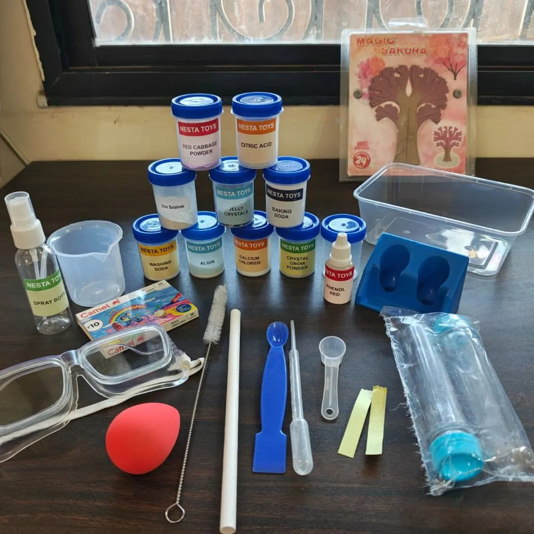 Kids chemistry lab kit with colorful experiment bottles, safety goggles, measuring tools, test tubes, and science accessories neatly arranged on a table for hands-on learning experiments.