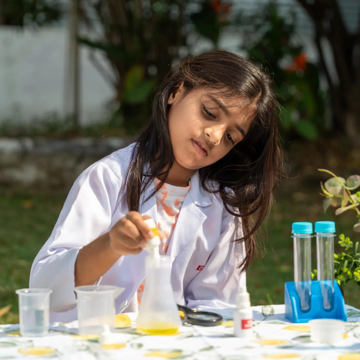 Child performing hands-on experiments with the Nesta Toys Junior Chemistry Lab Kit