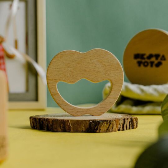 Wooden Apple Teether made from natural beech wood for babies to chew and soothe gums.