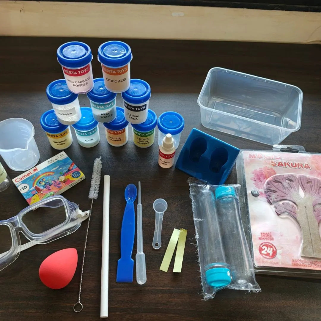 Kids chemistry lab kit with colorful experiment bottles, safety goggles, measuring tools, test tubes, and science accessories neatly arranged on a table for hands-on learning experiments.