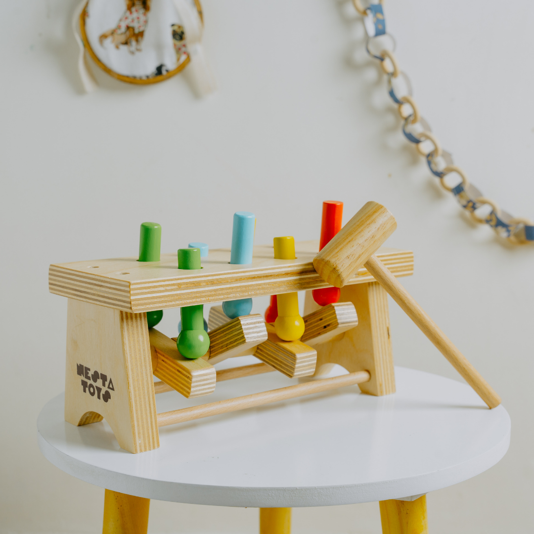 Durable wooden pounding bench toy with hammer for toddlers, crafted from natural wood by NESTA TOYS.