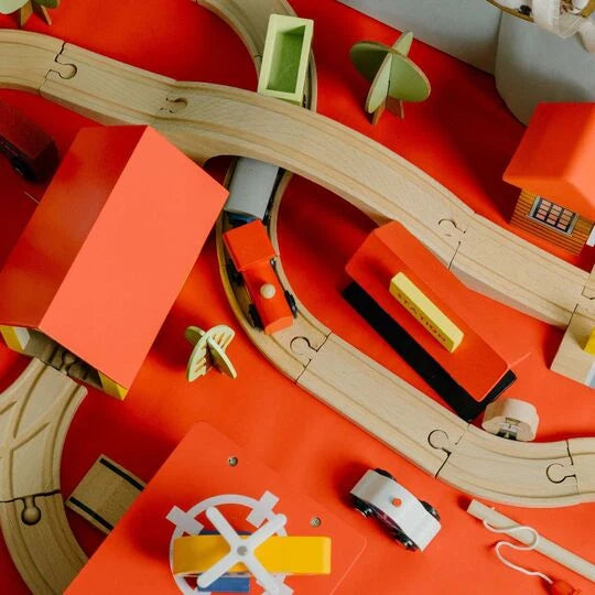 Wooden train track toy set with vehicles designed for creative and open-ended play